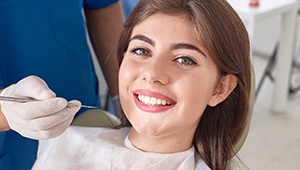 Happy woman relaxed in dental chair