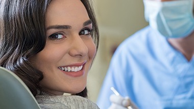 Smiling woman in patient treatment room