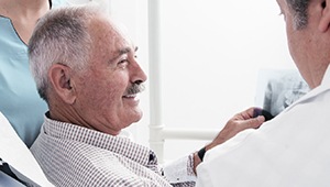 Senior patient smiling in dental chair