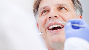 Relaxed man receiving dental care